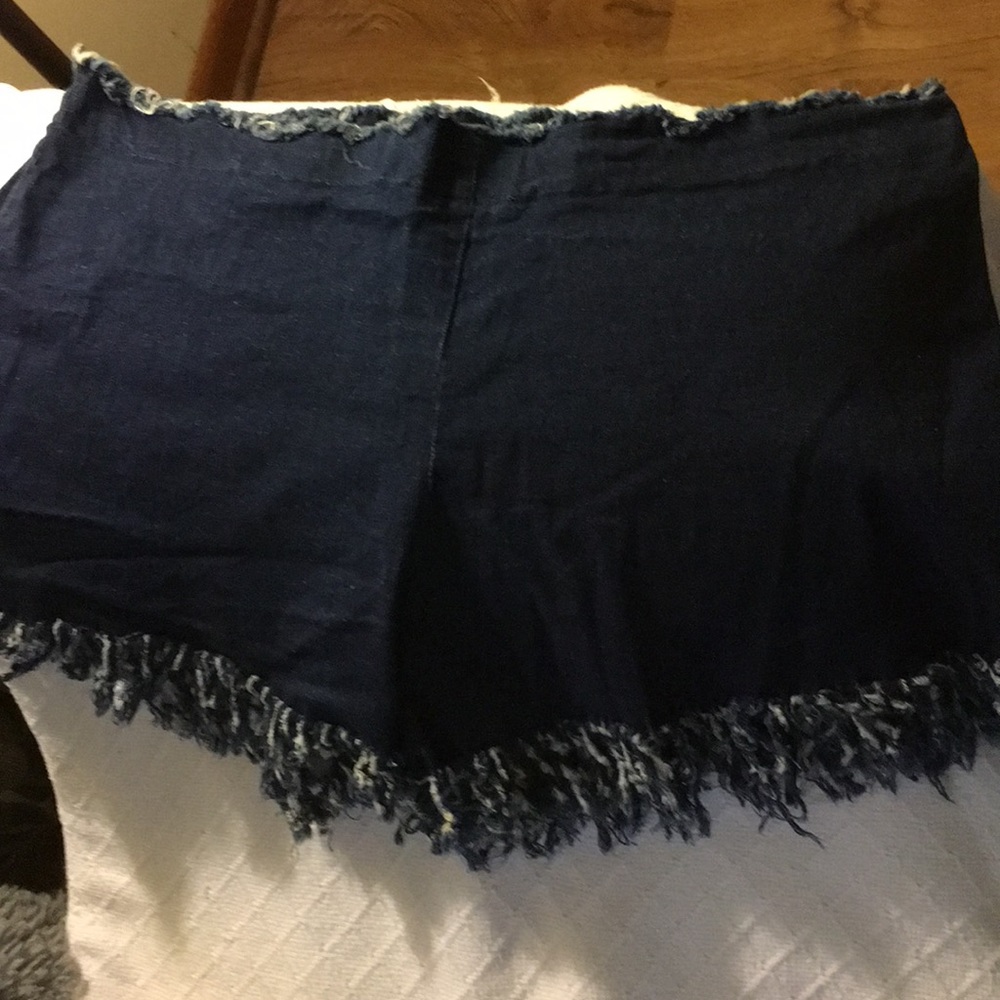Denim fringed shorts
